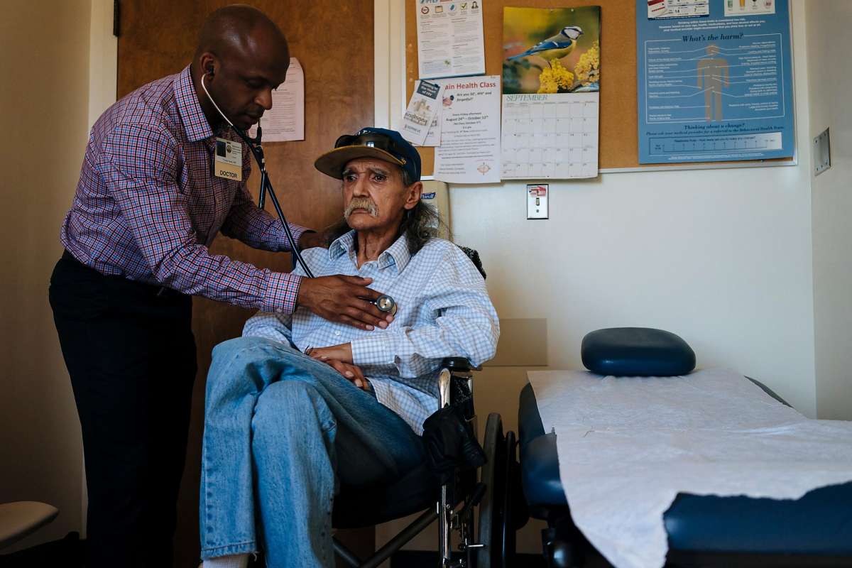 Dr. Hyman Scott, an HIV health care provider, checks the breathing of Richard Ramirez, 67, during a checkup at San Francisco General’s Ward 86, which specializes in HIV and AIDS.